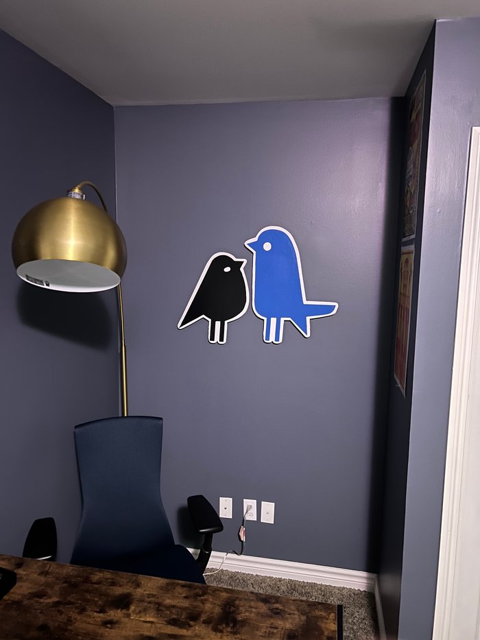Custom bird business logo cutouts on wall