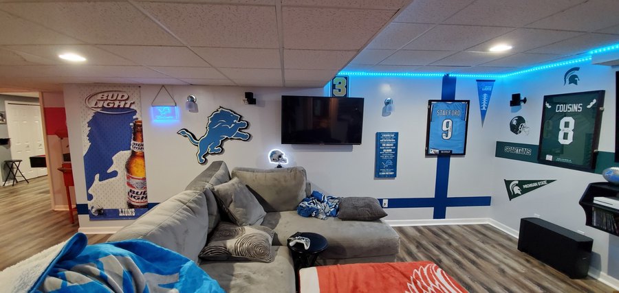 Custom Detroit Lions logo cutout in a Lions and Spartans basement fan cave