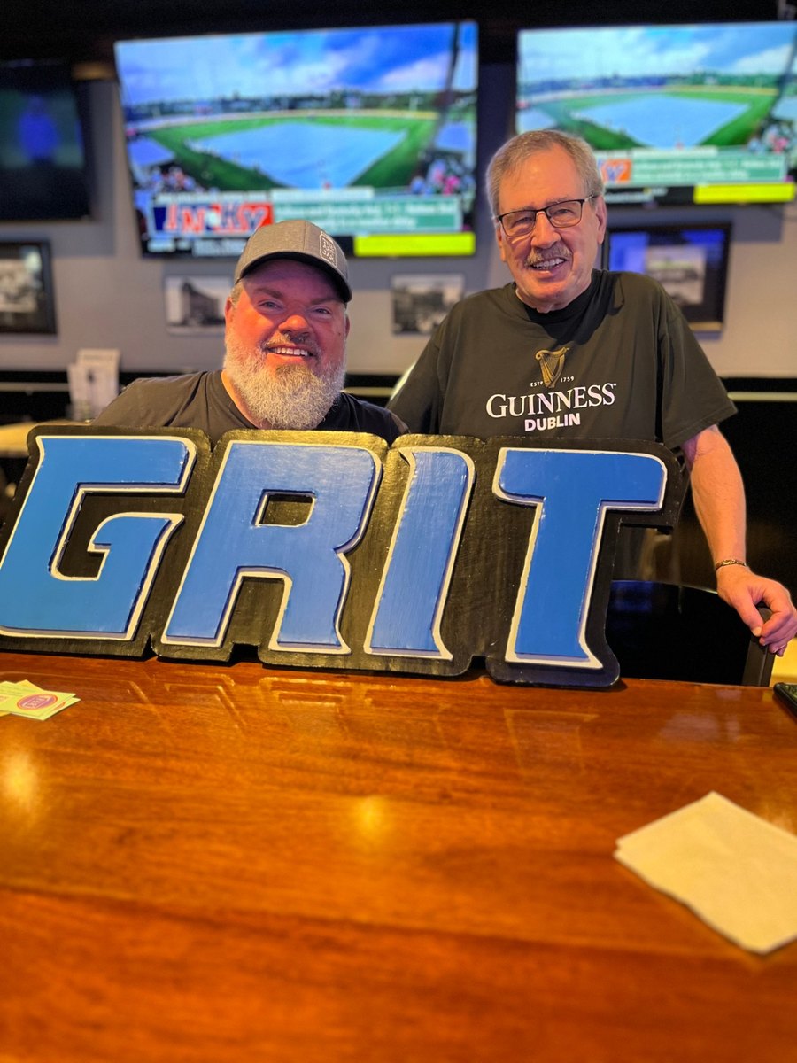 Custom GRIT sign for Detroit Lions fans, held at a bar