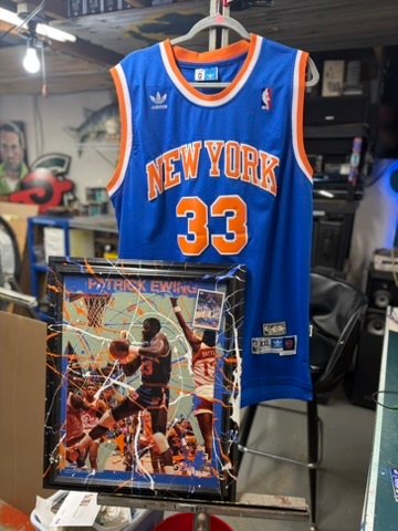 Hand-embellished Patrick Ewing New York Knicks poster in a splatter-painted frame with a number 33 Knicks jersey