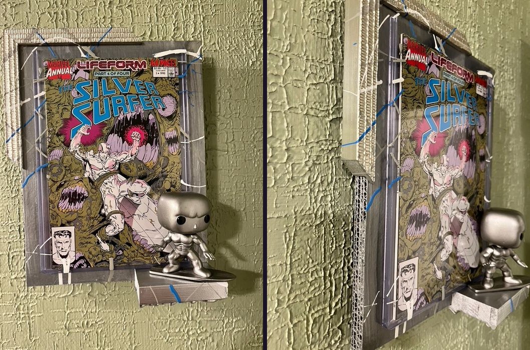 Hand-embellished Silver Surfer Marvel Annual comic in a silver frame with a Funko Pop Silver Surfer, front and side views