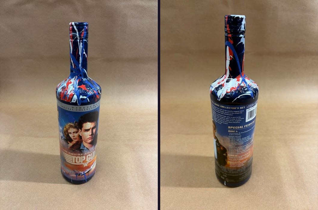 Hand-painted Top Gun collector's set bottle in red, white and blue splatter, front and back