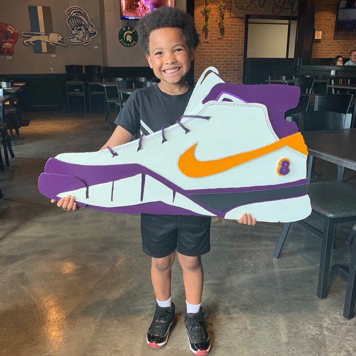 Custom Kobe sneaker cutout art, held by customer