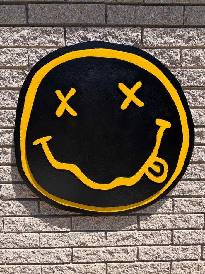 Nirvana smiley logo cutout