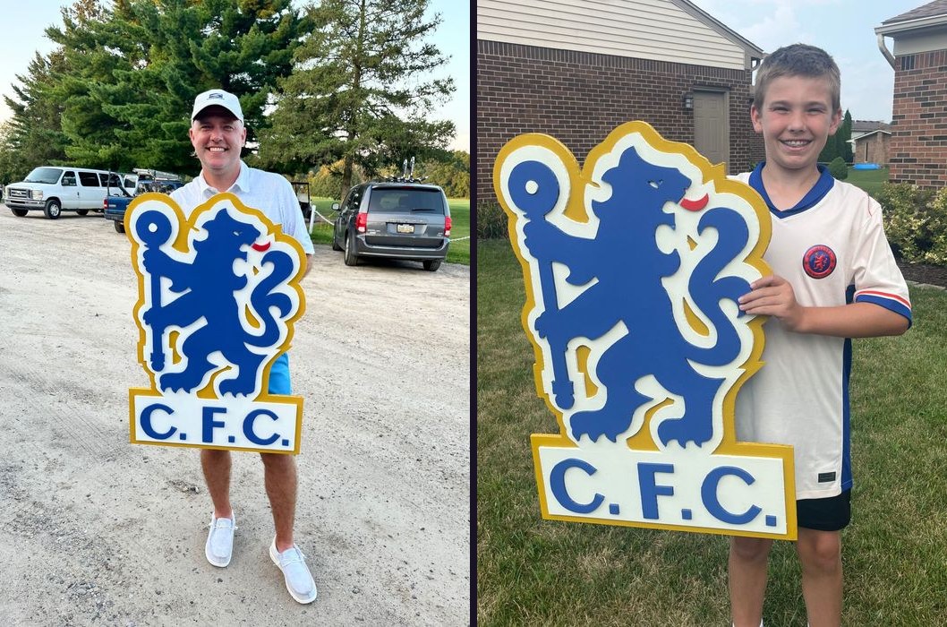 Custom Chelsea FC crest cutout, held by two different customers