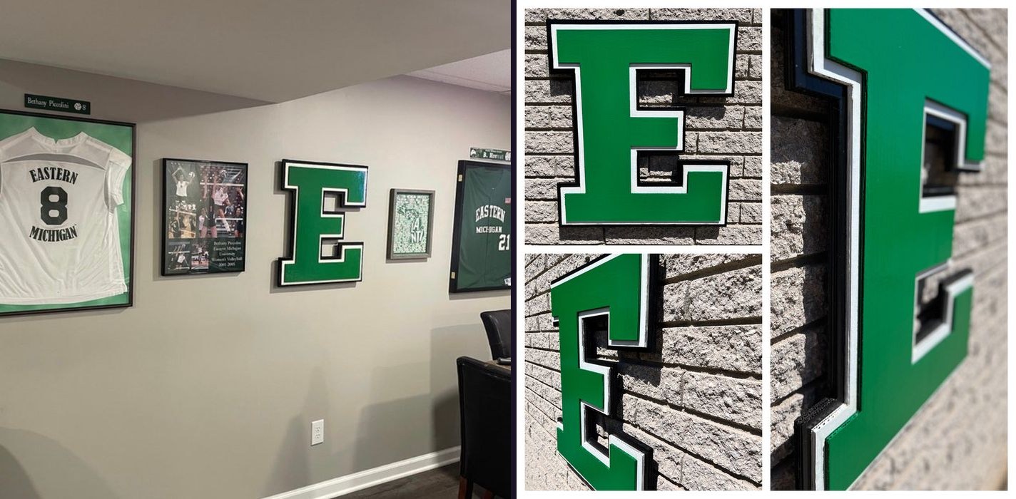 Custom green Eastern Michigan block E cutout on a basement memorabilia wall beside framed Eastern Michigan jerseys, and a collage of close-up angles of the E on brick