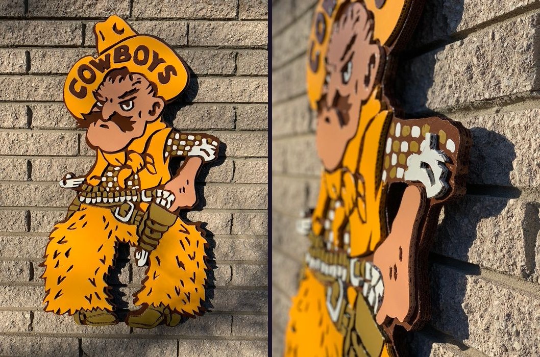 Custom Wyoming Cowboys Pistol Pete cutout in gold and brown on a brick wall, front view and an angled close-up showing the layered cardboard depth