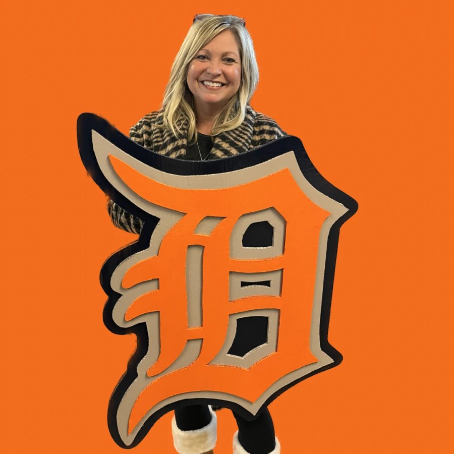 Customer holding a custom orange and navy Detroit Tigers Old English D cutout