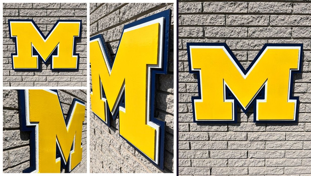 Custom large maize Michigan block M cutout with navy and white trim on a brick wall, collage of close-up angles and the full front view