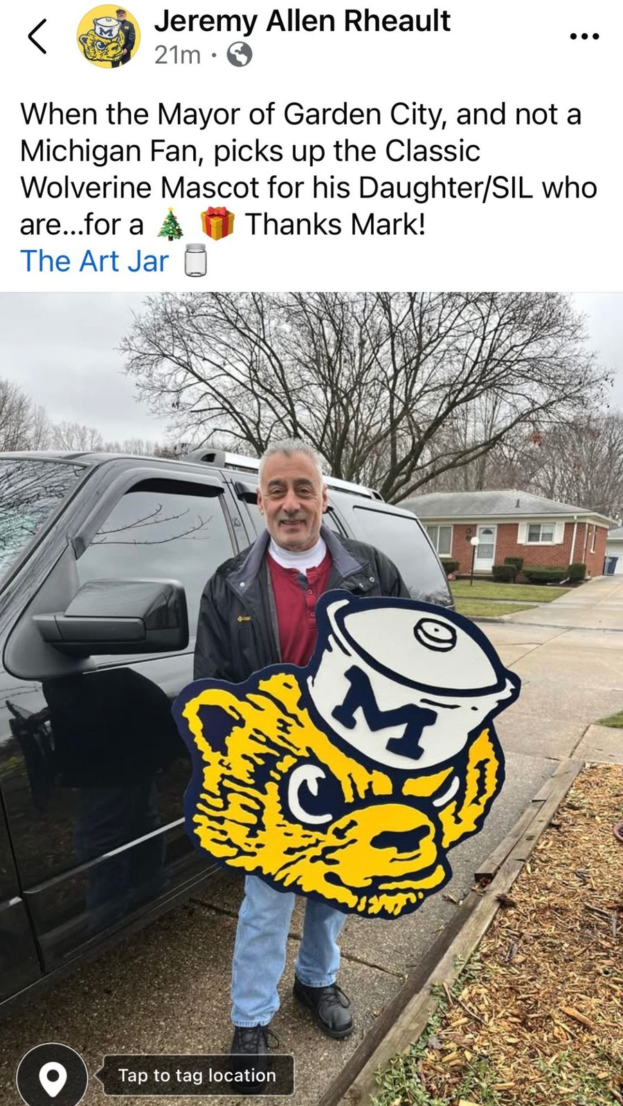 Facebook post: a customer picking up the Classic Wolverine Mascot cutout as a Christmas gift for his daughter and son-in-law