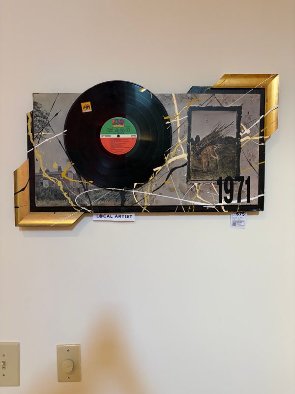 Led Zeppelin 1971 record art with a vinyl record and gold frame