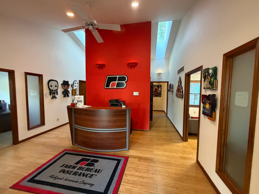 Reception area at Thomas Arbaugh Farm Bureau Insurance with art on the walls