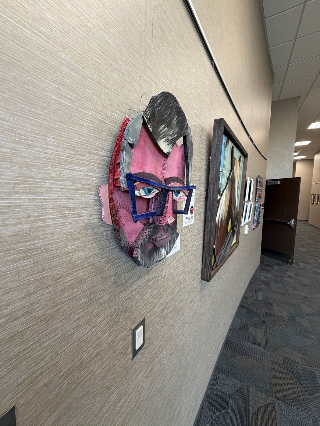 Side view of the cardboard self portrait standing out from the wall