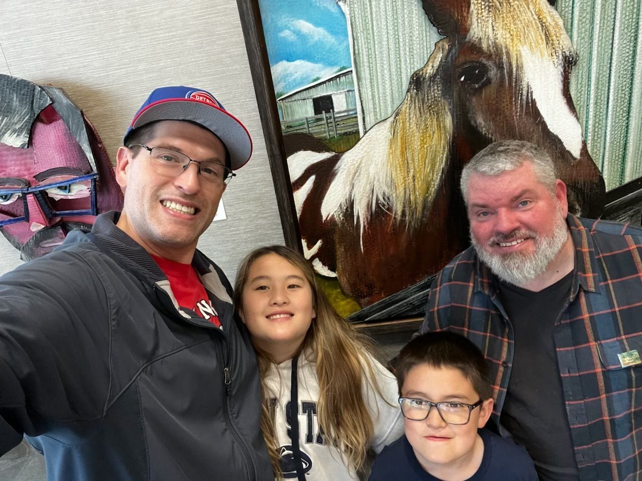 Selfie of Matt, Nahee, Tommy and Jeremy in front of Finn and Self Portrait