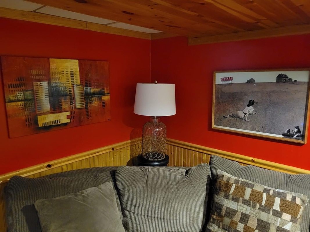 Christina’s Liberty hanging on a red wall in a home