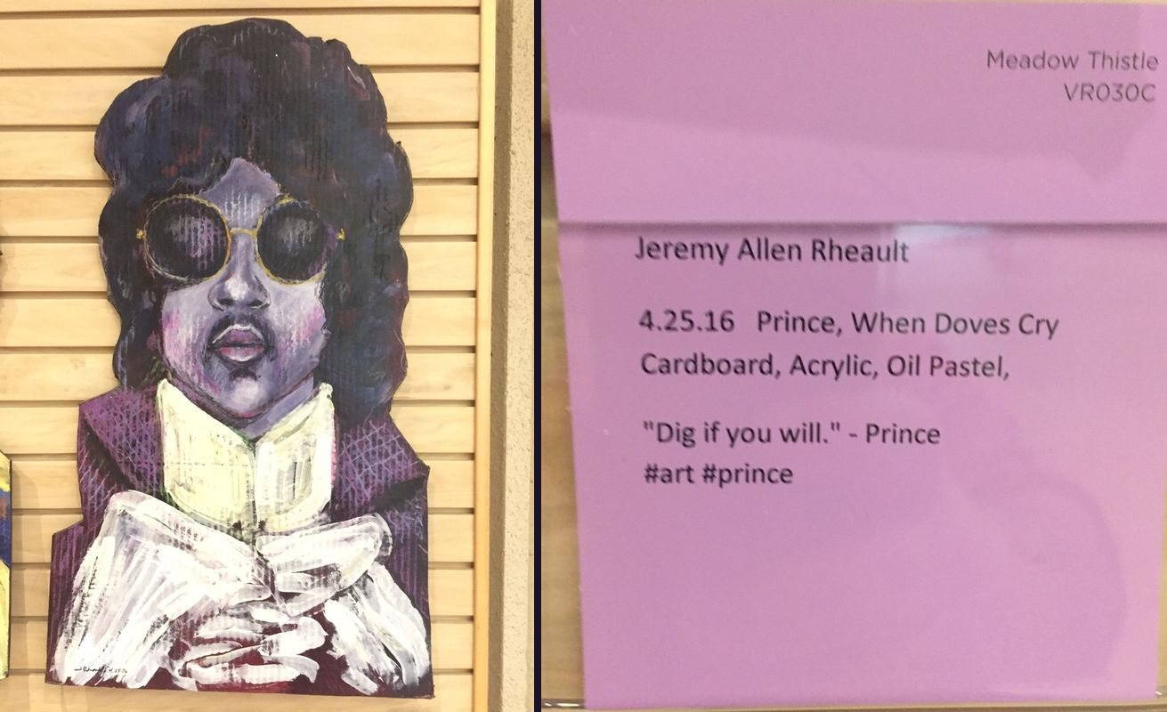 Painted cardboard portrait of Prince in round sunglasses next to its gallery card