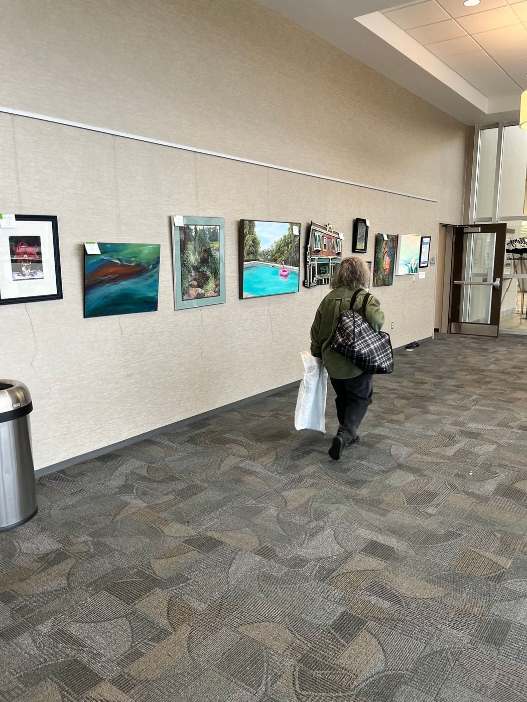 The gallery hallway at Westland City Hall lined with framed artwork