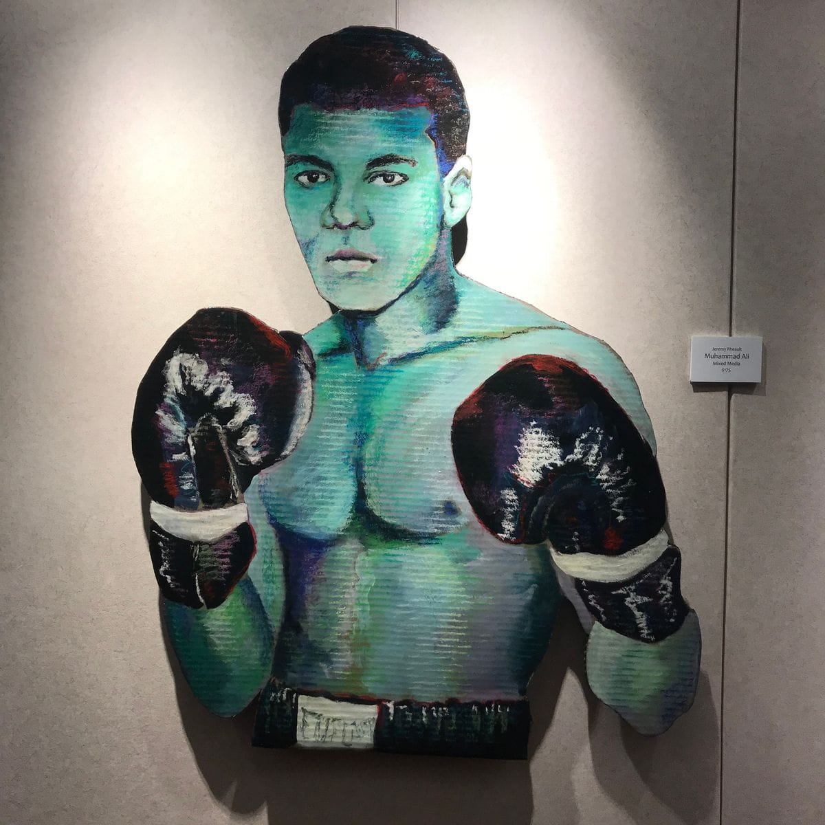 Muhammad Ali by Jeremy Rheault on the wall at The Village Theater