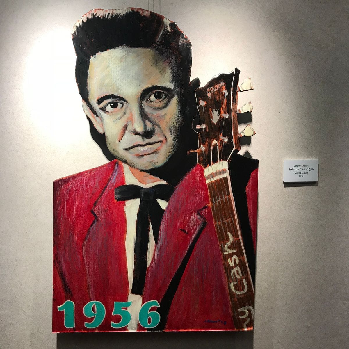 Johnny Cash 1956 by Jeremy Rheault on the wall at The Village Theater