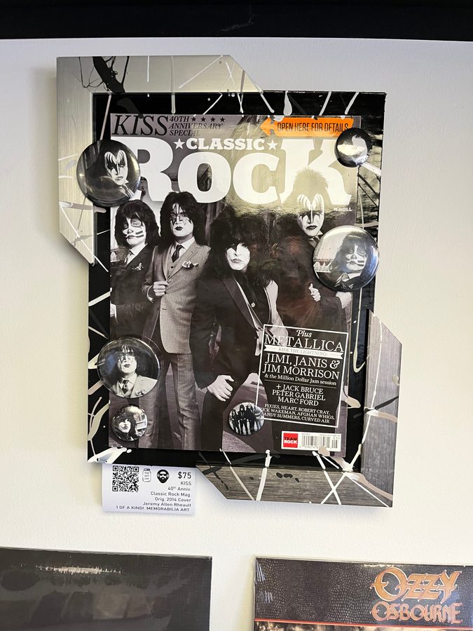 Hand-embellished Classic Rock magazine cover piece featuring KISS on the wall at Vinyl People Records