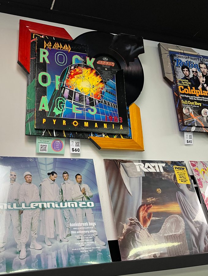 Hand-embellished Def Leppard Pyromania album cover piece on the wall at Vinyl People Records
