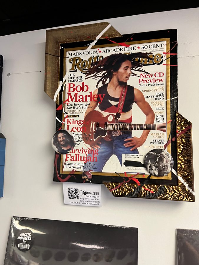 Hand-embellished Rolling Stone cover piece featuring Bob Marley on the wall at Vinyl People Records